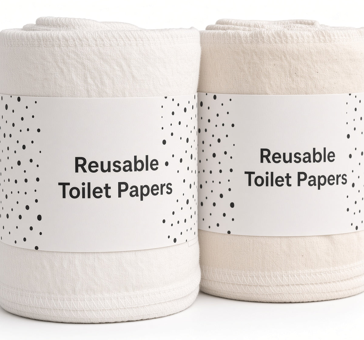 Close-up of two soft reusable cotton cloth rolls with stitched edges in white and natural cotton