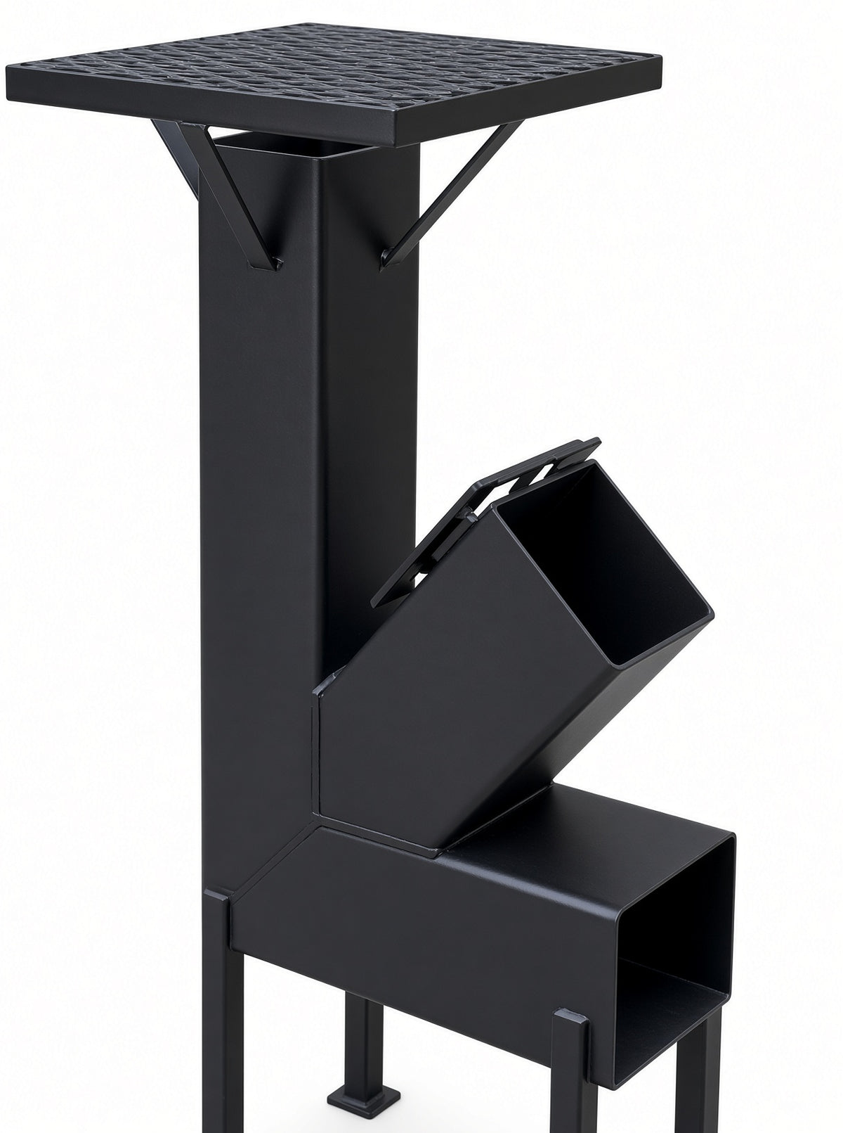 Close-up of steel rocket stove cooking grate, chimney braces and angled wood feed chute